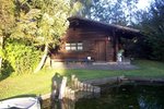 Pond site with log cabin