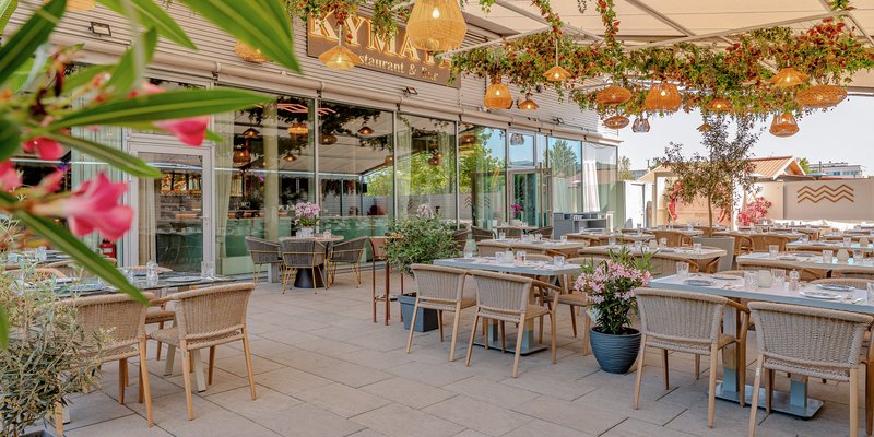 Kymata Modern - A Mediterranean welcome: the leafy entrance and terrace area at Kymata Modern.