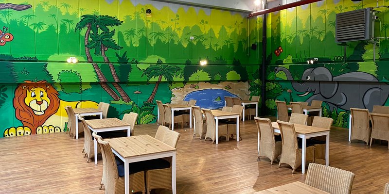 Indoor playground with e-cart track