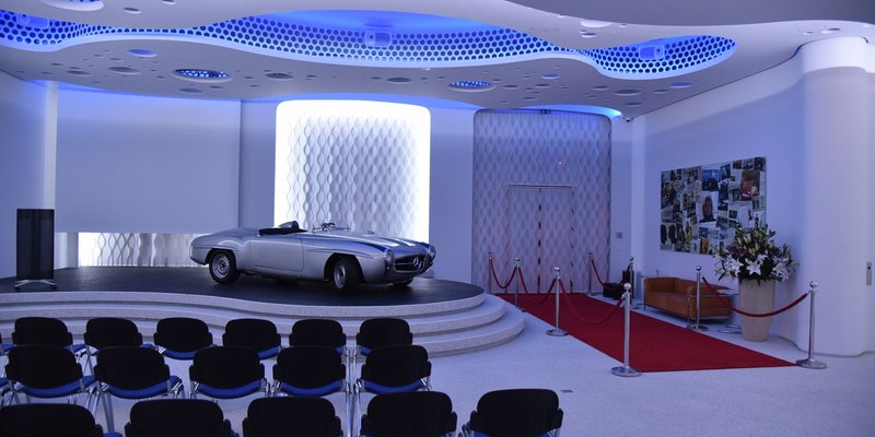 Classic car showroom with organic shapes