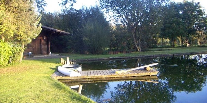 Pond site with log cabin