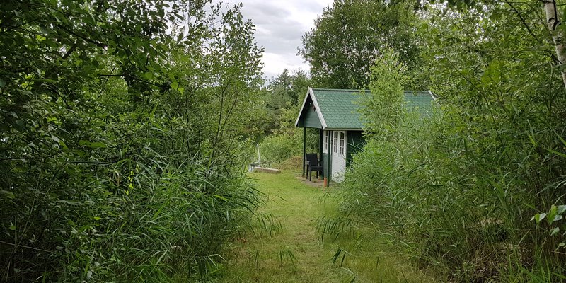Lake with hut, jetty and water terrace